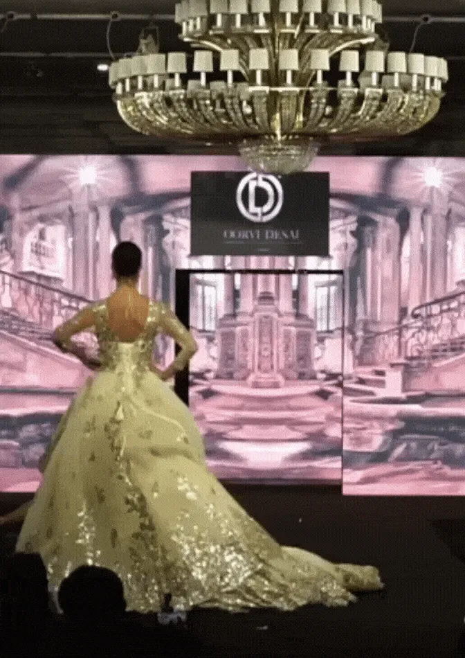 White and Gold Net-Based Designer Show-stopper Gown with Layered Trail